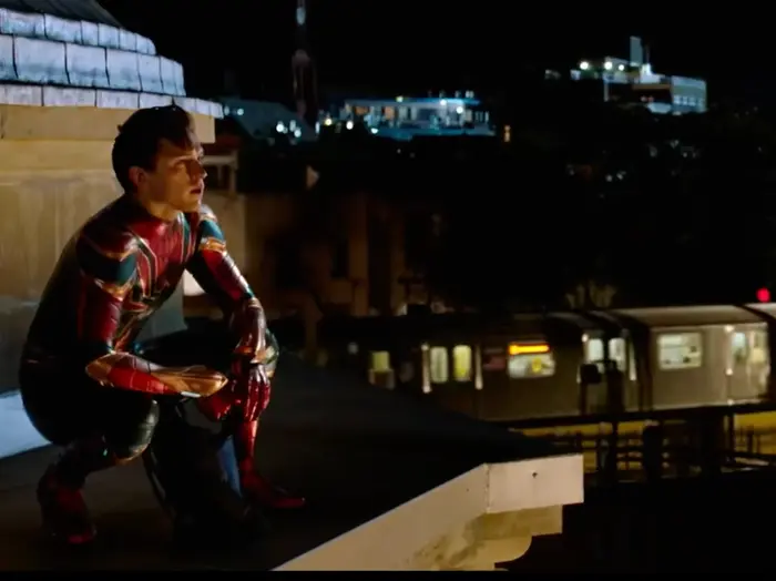 Spider Man watches at wall with iron man picture meme | image tagged in memes | made with Piñata Farms meme generator