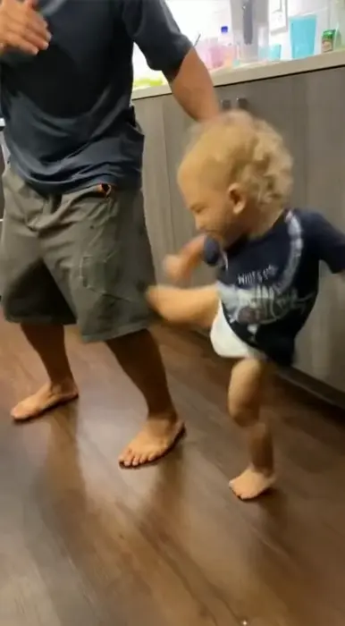 baby kicks dad meme | image tagged in memes | made with Piñata Farms meme generator